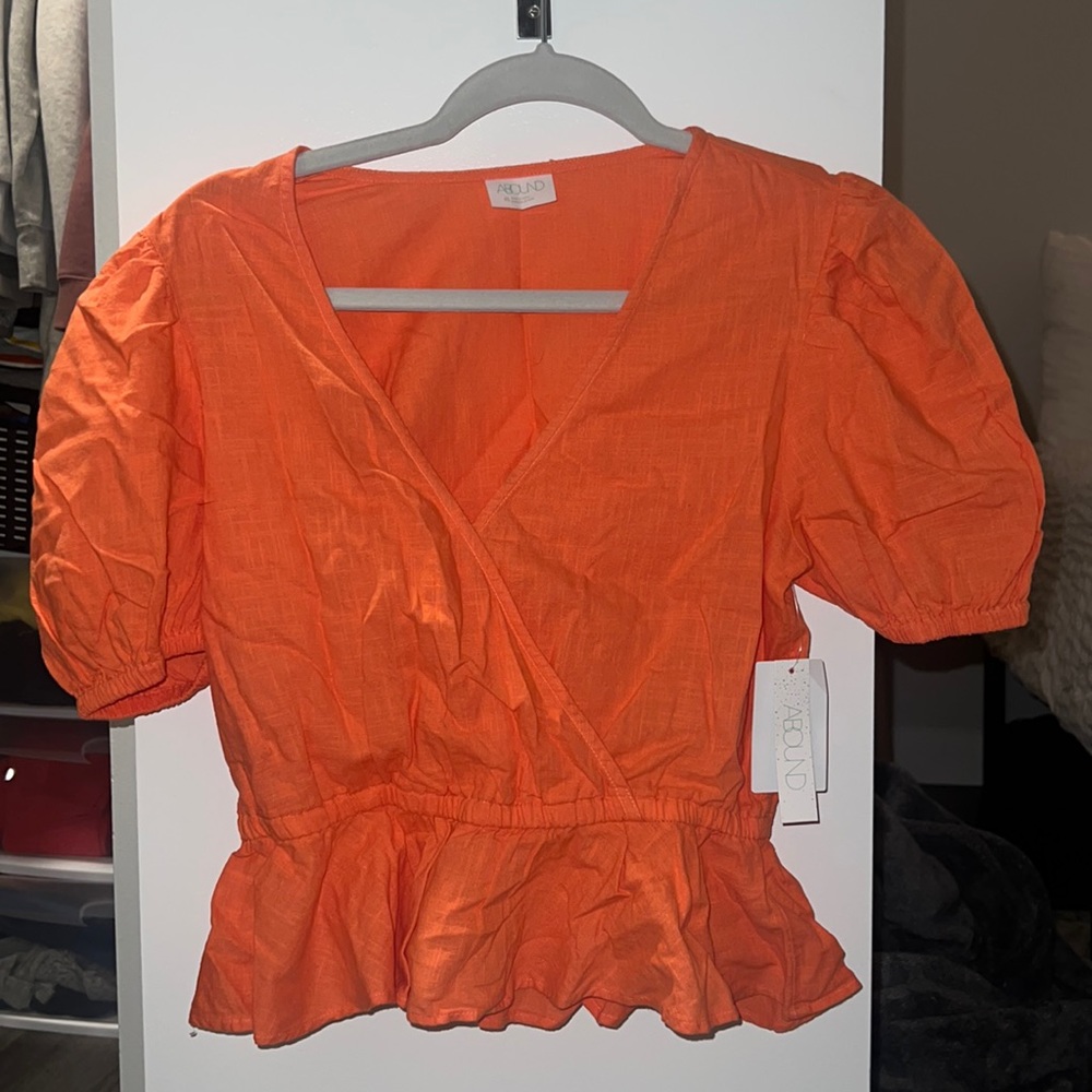 Orange peplum top